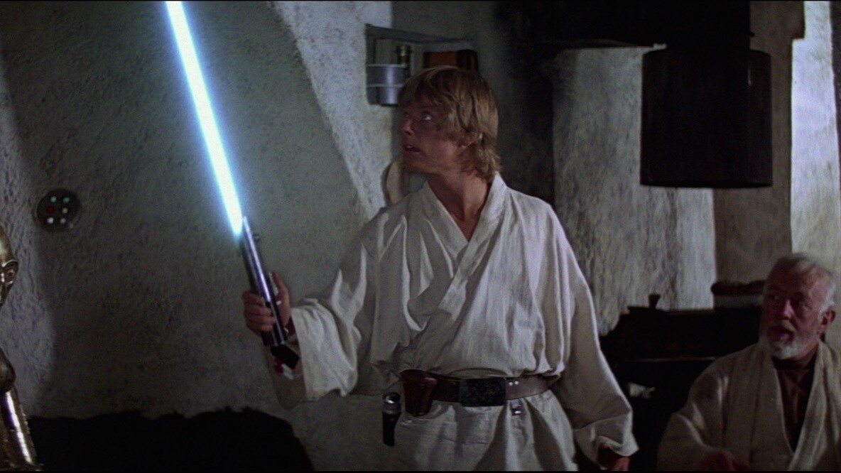 Luke with his lightsaber